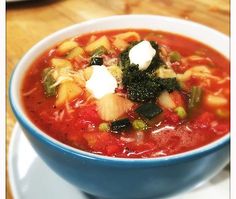 a bowl of vegetable soup on a plate