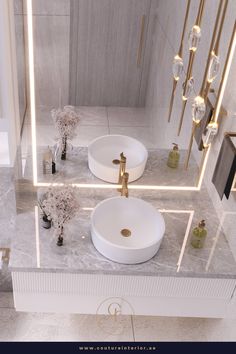 a bathroom with two sinks and mirrors on the wall