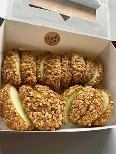 an open box filled with apple slices and oatmeal