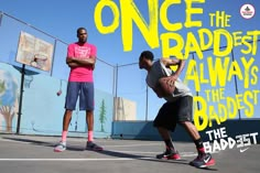 two young men are playing basketball on the court, one is about to throw the ball