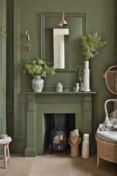 a living room with a fireplace, mirror and potted plants on the mantel