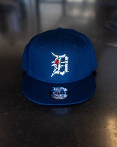 New Era 9FIFTY FIT: Features a classic, throwback look with a flat visor that can curve with a full crown. Includes a structured front panel for stability and an open back with snapback closure. 100% cotton Structured High-profile 7-position adjustable snap closure Please give us 1-4 business days before your order is shipped out. Love Rap, New Era Hat, Big Face, Hats Snapback, Plant Collection, New Era, Navy Blue, Navy, Blue