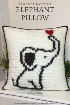 an elephant pillow is sitting on a shelf with the text crochet pattern elephant pillow