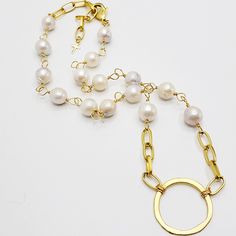 Unique and elegant are words to describe this stunning necklace. It is a beautiful high grade Keshi pearl, hand-chained with 14kt gold wire, that is brought together in the center by a beautiful gold ring wear plain or add one of our beautiful enhancers on it. At the end of the chain there is a beautiful 14kt gold cross reminding us of God's wisdom that is ready and available for us. Adjustable from approximately 16 inches with a 2.5 inch extension chain. No mention shall be made of coral or of Everyday Pearl Necklace With Adjustable Chain, Wire Wrapped Pearl Necklace In Gold, Elegant Everyday Wire Wrapped Jewelry, Pearl Jewelry With Adjustable Chain, Pearl White Round Jewelry With Adjustable Chain, Yellow Gold Long Necklace With Pearl Chain, Elegant Yellow Gold Wire Wrapped Necklace, Elegant Adjustable Wire Wrapped Chain Necklace, Elegant Adjustable Wire-wrapped Chain Necklace