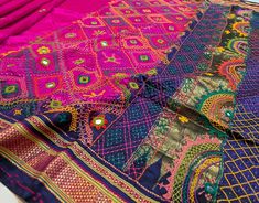 an intricately designed pink and blue sari