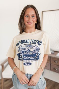 Get ready to take on the wild with the Bronco Vintage Tee. Made with a retro design and comfortable fit, this tee is perfect for any adventure. Model is 5’4 wearing a size small S 2-4, M 6-8, L 10-12, XL 12-14 Vintage Tee Fits True to Size Screen-Printed Casual Soft-washed Tops For Outdoor, Graphic Tee With Crew Neck For Outdoor, Sporty Crew Neck Tops For Adventure, Casual Soft-washed Tops For Outdoor Activities, Cotton Tops With Front Print For Outdoor Activities, Graphic Tee With Text Print For Outdoor Activities, Graphic Tee Tops With Text Print For Outdoor Activities, Graphic Print Cotton Top For Outdoor Activities, Casual Tops With Front Print For Outdoor Activities