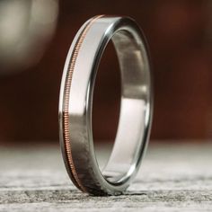 a close up of a wedding ring on a table