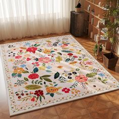 a white rug with colorful flowers on it