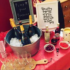 a table topped with bottles of wine and glasses