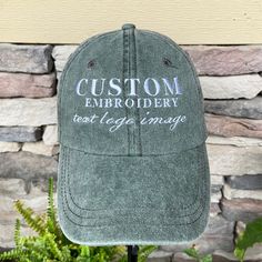 CUSTOM EMBROIDERED CAPS with personalized text, logo or graphic image! What a perfect opportunity it is to creatively embroider your custom text, company logo, or image onto a baseball cap! We have a variety of options for you to customize your hat exactly the way you envision it, and offer a growing collection of cap colors, thread, and font options.  Choose from the following:  1) Custom text on front $26.95 2) Custom text on front and back $34.49 3) Custom text on back only $24.95 4) Custom i Customizable Cotton Baseball Cap With Curved Bill, Customizable Curved Bill Cotton Baseball Cap, Customizable Cotton Trucker Hat With Curved Bill, Custom Cotton Hat With Curved Bill, Customizable Cotton Hat With Curved Bill, Customizable Cotton Trucker Hat One Size, Customizable Cotton Trucker Hat, Custom Baseball Cap, Image Logo