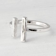 "Sterling Silver Bar Cuff Ring A simple, classy cuff ring featuring two vertical bars. A great minimalist look :) We package this lovely ring in a white gift box. This ring is handmade in our studio, the ring is slightly adjustable, due to the open band. Don't know your ring size? https://www.etsy.com/listing/126357720/fall-sale-ring-sizer-ring-size-ring Are you new to Etsy? Shop my store and add your favorite items from The Jewelry Girls to your cart. Most of my items can be made in your size o 14k Gold Ruby Ring, Silver Cuff Ring, Open Cuff Ring, Bubble Ring, Bar Ring, Cuff Ring, Cuff Rings, Ring Minimalist, Minimalist Ring