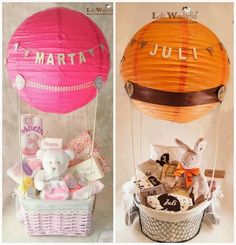 two hot air balloons that say mary and julia in different colors, one with a stuffed rabbit inside the balloon