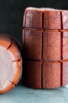 a piece of cake sitting next to a chocolate pastry