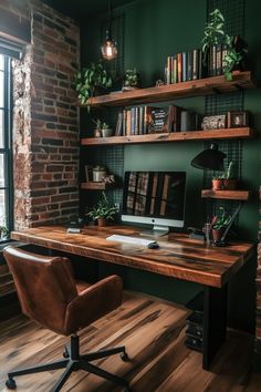 a home office with green walls and wooden shelves