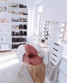 an image of a room with white furniture and shoes on the shelves in front of it