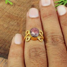 Rhodonite Ring- Split Band- Gold Plated- Brass- Pink Stone- Handmade- Adjustable Ring- Oval Stone- Designer- Charm- Men Women Ring- Gifts Description: Weight : 2.81 Gram Approx Metal : Brass Gemstone : Rhodonite Stone Size : 9 x 8 Mm Approx handmade Item ** This Item is Made to Order ** Handmade Adjustable Ruby Ring, Handmade Adjustable Oval Crystal Ring, Adjustable Pink Ruby Ring Gift, Handmade Pink Oval Ruby Ring, Handmade Adjustable Oval Ruby Ring, Adjustable Oval Pink Jewelry, Handmade Adjustable Ruby Ring For Anniversary, Adjustable Pink Oval Jewelry, Pink Adjustable Oval Jewelry