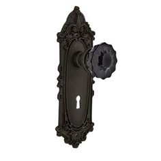 an ornate door handle with a keyhole