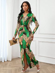 a woman in a green and gold dress standing on a wooden floor with her hands on her hips