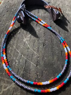 Grey, turquoise, white, orange, red, and yellow. Combined to create this beautiful Anne Oakley necklace. Southwestern Multicolor Beaded Necklaces For Beach, Southwestern Style Multicolor Beaded Necklaces For Beach, Southwestern Style Multicolor Beaded Necklace For Beach, Southwestern Adjustable Jewelry With Colorful Beads, Handmade Adjustable Western Beaded Necklace, Hand-strung Multicolor Beaded Lariat Necklace, Multicolor Handmade Turquoise Necklace For Festivals, Southwestern Style Multicolor Necklace For Beach, Multicolor Beaded Turquoise Necklace For Festivals