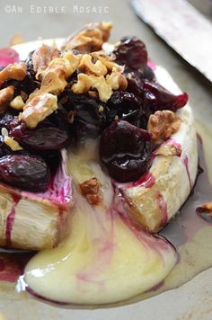 the dessert is topped with fruit and nuts