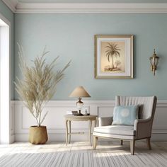 a chair and table in a room with blue walls, white trimmings and palm trees on the wall