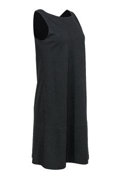 Simple can sometimes make a statement when you wear this soft knit beauty from Eileen Fisher! Made with a shapeless shift silhouette, this is a versatile piece to wear with all your favorite jackets and more! How you wear it is up to you! Size XS 71% Viscose, 24% Nylon, 5% Spandex Shift silhouette Rounded neckline Fully lined Material provides stretch No closures Waist 36" Bust 27" Total length 39.5" Knit Dresses For Layering, Stretch Sweater Dress For Work, Eileen Fisher, Soft Knits, Dresses Xs, Round Neckline, Shift Dress, Little Black Dress, Knitting