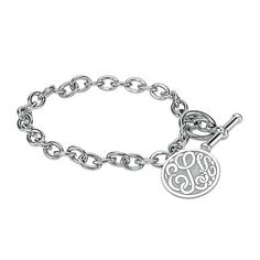 Wear this monogram charm bracelet as a constant reminder of the bond you share with someone special. Initials will appear exactly as entered. Must be three letters, center initial will be enlarged. Made in America.Metal: Rhodium-plated sterling silverClosure: ToggleDimensions: 7¼" long circular chainPendant Size: 20mmPersonalize: Up to 3 script initials. Initials will appear exactly as entered; center initial will be enlargedCare: Wipe CleanCountry of Origin: USJewelry photos are enlarged to sho Silver Monogram Bracelet, Black Hills Gold Jewelry, Family Jewelry, Bracelets Charm, Monogram Bracelet, Silver Monogram, Family Jewellery, Black Hills Gold, Hot Jewelry