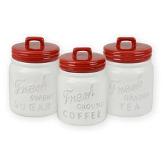 four white ceramic canisters with red lids on each one and the words fresh coffee printed on them