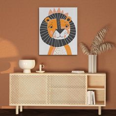 a wall mounted art piece with a lion on it's face in a living room