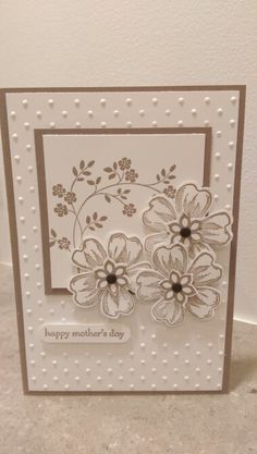 a card with flowers on it and the words happy mother's day written in white