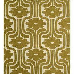 a green and white rug with an abstract design on the front, featuring large flowers