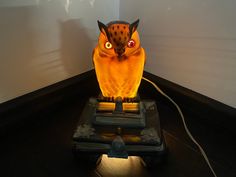 an owl lamp sitting on top of a table