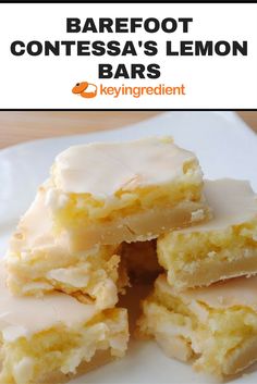 a white plate topped with lemon bars on top of a wooden table and text overlay that reads, barefoot contessa's lemon bars