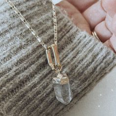 The Stunning LQ Crystal Quartz Necklace is the perfect accessory to elevate any outfit. A long, delicate chain that drapes elegantly around the neck and is accented with a glamorous crystal quartz pendant. Quartz is said to promote healing and balance, making it a great addition to your daily routine. The LQ Necklace is made with gold filled materials, giving it a luxurious and high-end look. Perfect for dressing up or down, and makes a great gift for any occasion. Add a touch of elegance and po Gold Herkimer Diamond Necklace As A Gift, Gold Necklaces With Herkimer Diamond For Gift, Gold Quartz Necklace With Spiritual Style, Gold Spiritual Crystal Necklace For Everyday, Everyday Gold Spiritual Crystal Necklace, Everyday Spiritual Gold Crystal Necklace, Minimalist Gold Quartz Necklace, Gold Spiritual Crystal Necklace, Gold Faceted Pendant Crystal Necklace