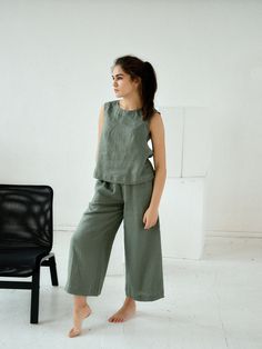 "Moss green culottes linen pants for woman. Midi loose flared pants with pockets. Choose size: XS Waist 66 - 68 cm. / (26\" - 26 3/4\") Hips 90 - 92 cm. / (35 1/2\" - 36 1/4\") S Waist 70 - 72 cm. / (27 3/4\" - 28 1/4\") Hips 94 - 96 cm. / (37\" - 37 3/4\") M Waist 74 - 76cm. / (29 1/4\" - 30\") Hips 98 - 100 cm. / (38 1/2\" - 39 1/4\") L Waist 78 - 80 cm. / (30 3/4\" - 31 1/2\") Hips 102 - 104 cm. / (40 1/4\" - 41\") XL Waist 82 - 84 cm. / (32 1/4\" - 33\") Hips 106 - 108 cm. / (41 3/4\" - 42 1 Green Linen Wide Leg Pants For Work, Green Linen Wide Leg Bottoms, Khaki Wide-leg Linen Pants, Spring Khaki Linen Pants, Khaki Wide Leg Linen Pants, Green Wide Leg Pants With Pockets For Summer, Green Linen Wide Leg Pants For Spring, Spring Green Linen Wide Leg Pants, Casual Green Wide-leg Culottes