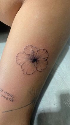 a woman's thigh with a flower tattoo on her left leg and the words, no matter where