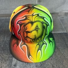 This is an airbrushed hat featuring a Colorful Neon Lion design.  This hat is adjustable and will fit almost anyone.  These hats are waterproof and can withstand a good soaking but they should not be washed in a washing machine or dish washer.  Thank you, Brad. Shipping is free for this item anywhere in the US. Adjustable Outdoor Baseball Cap With Flat Crown, Multicolor Flat Bill Baseball Cap For Outdoor, Multicolor Flat Brim Snapback Hat For Streetwear, Multicolor Snapback Baseball Cap For Outdoor, Multicolor Snapback Hat With Flat Bill, Multicolor Adjustable Snapback Hat With Flat Bill, Adjustable Multicolor Snapback Hat With Flat Bill, Multicolor Adjustable Flat Brim Baseball Cap, Adjustable Multicolor Flat Brim Baseball Cap