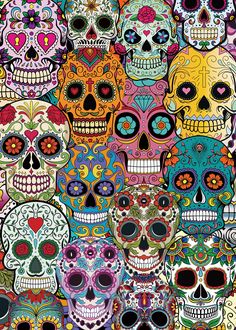 a large group of colorful skulls with different colors