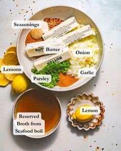 ingredients to make lemon tea on a plate with lemons and seasonings in bowls