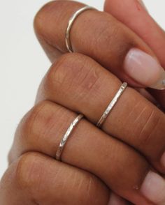 The Silver Hammered Stacking Ring Set features three soldered rings that are handmade to order. Each set includes three stackable rings that have a subtle shiny sparkle. These rings can be worn all together on one finger, and also look great spread out on multiple fingers. Available in midi and regular sizes. Please provide up to three sizes at checkout. If no size is provided, I'll make the rings in a general midi ring size (3, 4, 4.5) *Size comparison: a normal ring size 6 would usually fit a Artisan Adjustable Stackable Jewelry, Unique Hammered Rings For Everyday Wear, Adjustable Double Band Stackable Rings In White Gold, Adjustable White Gold Double Band Stackable Rings, Handmade Stackable Rings For Everyday Wear, Hand-forged Ring Jewelry For Everyday, Adjustable Metal Ring Jewelry, Silver Adjustable Midi Rings, Adjustable Silver Midi Rings For Everyday Wear