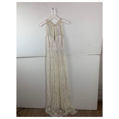 This Dress Is A Stunning And Timeless Piece That Exudes Elegance And Grace. Crafted From Delicate White Lace, This Sleeveless Maxi Dress Is A Masterpiece Of Feminine Design. Its Intricate Lace Detailing Adds A Touch Of Vintage Charm, While The Maxi Length Creates A Flowing Silhouette That's Perfect For Special Occasions. White Maxi Dress With Lace Bodice For Spring, Sleeveless Lace Back Dress, Sleeveless Lace Maxi Dress For Wedding, White Summer Dress With Lace Back, White Summer Dresses With Lace Back, White Lace Back Summer Dress, White Lace Dress With Lace Back For Spring, White Sleeveless Maxi Dress For Wedding, Bohemian Sleeveless Lace Party Dress