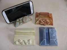 four soaps and a cell phone on a table