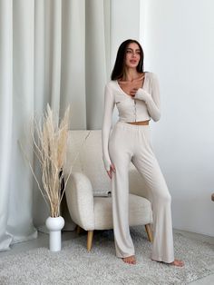 Meet our collection of knitted viscose. A soft and pleasant to the touch set, which is nice to wrap yourself in after a working day 🫶🏻 Natural home set / pajama pants + top with long sleeve viscose High-rise pants, soft elastic and perfect length, loose cut, so they are very comfortable. The top nicely delineates and does not constrain movements. A great option for clothes for home, for sleep, a great gift for a birthday, anniversary, wedding, anniversary or any other holiday for a mother, beloved wife, girlfriend, daughter, sister, close friend buy at More. Colors: milky Model is wearing size XS-S and is 5'6"/172cm (86/60/92) XS Bust - 32.3 - 33.7 inches (82-86 cm) Waist - 23.6 - 26 inches (60-66 cm) Hips - 34.6 - 37 inches (88-94 cm) S Bust - 33.7 - 35.5 inches (86-90 cm) Waist - 26 - Beige Long Sleeve Sets For Home, Stretch Long Sleeve Pant Set For Loungewear, Beige Casual Pajama Party Sets, Casual Beige Sets For Pajama Party, Casual Beige Pajama Party Sets, Cozy Fitted Loungewear Sets, Chic Long Sleeve Sleep Sets, Long Sleeve Matching Pant Set For Loungewear, Cozy Cream Loungewear Sets