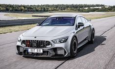 the mercedes amg gt is driving on a race track