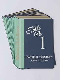 a set of four wedding table numbers on top of each other in blue and green