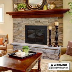 a living room with a stone fireplace and mirror on the wall above it's mantle