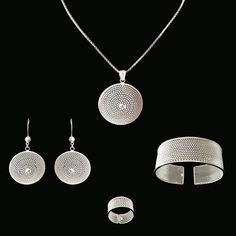 Fully handmade, 925 Sterling Silver Set. This silver jewellery set was made carefully by master artisans to represent the cleansing and inspiring power of the Moon, as celebrated by local tradition. The total silver weight of the whole set is approximately an astonishing 37 grams. The Moon set is fully handmade, made from real sterling silver. It includes: .Earrings .Ring .Pendant  .Bangle It is a fantastic, eye-catching set to make you shine in special or even everyday occasions.  __ Limited stock  - as this is  handmade product, please make your orders ahead of time. If out of stock, please try to place an order again next month.  Notes: Pendant chain Not included. If you wish to purchase a suitable silver chain for the pendant click on the chains collection and add it to your cart befor Hand-set Round Sterling Silver Jewelry, Hand Set Round Sterling Silver Jewelry, Hand Set Round Jewelry Sets For Gifts, Silver Sterling Silver Jewelry Sets, Round Sterling Silver Jewelry Sets, Sterling Silver Jewelry Sets As A Gift, Minimalist Silver Jewelry Sets For Gifts, Handmade Round Jewelry Sets For Gifts, Sterling Silver Fusion Jewelry For Wedding