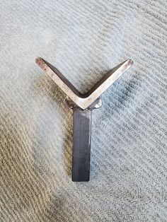 a close up of a metal object on a carpeted floor with no one around it