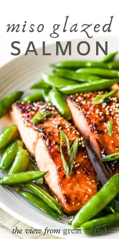 salmon and green beans on a white plate with the words miso glazed salmon above it