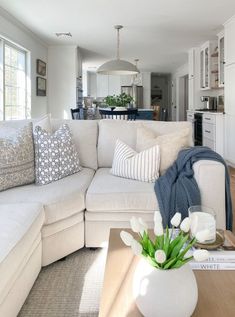 Recently, I realized that since I started adding a touch of modern coastal decor to our home, I don’t need to do a lot of seasonal decorating. By sticking with a color scheme that reflects the ocean and sky–including crisp whites, deep blues and neutral hues–everything seems to work together, no matter what time of... Room Inspo Coastal, Orange Decorations, Nature Decorations, Modern Coastal Living Room, Pottery Barn Living Room, Green Decoration, Modern Coastal Decor, Barn Living, Apartments Decorating